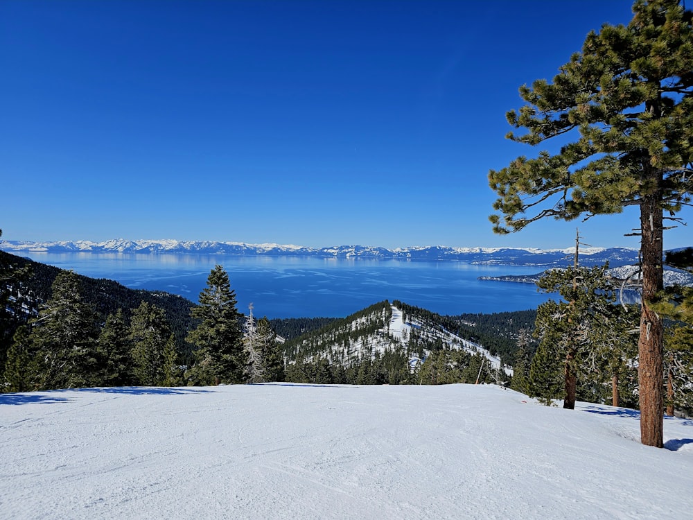 a view of a mountain with a lake in the distance