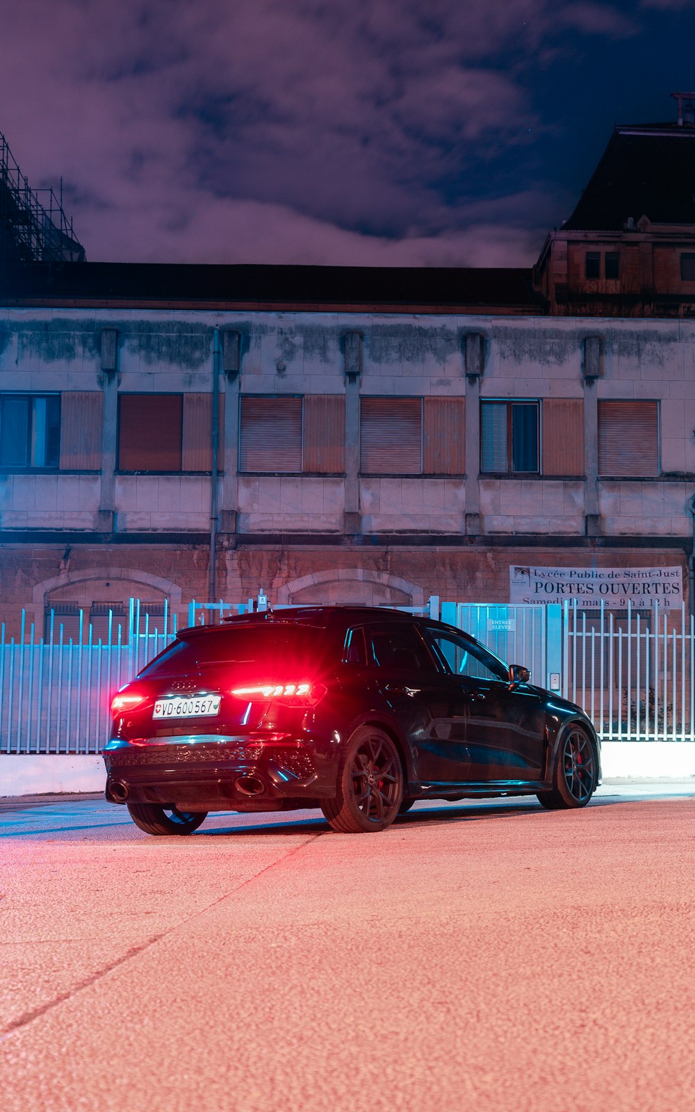 a police car parked in front of a building