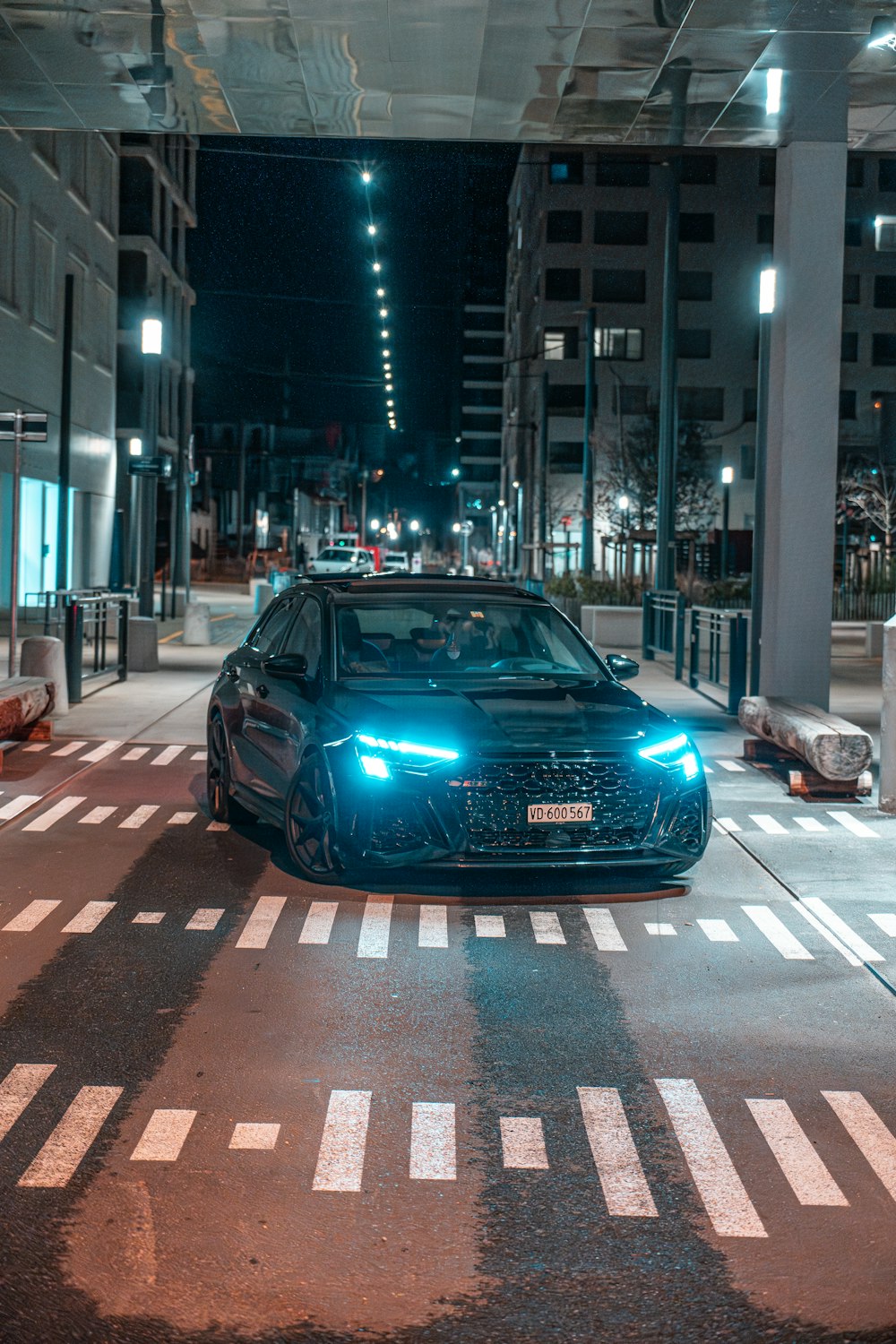 a car parked in a parking garage at night