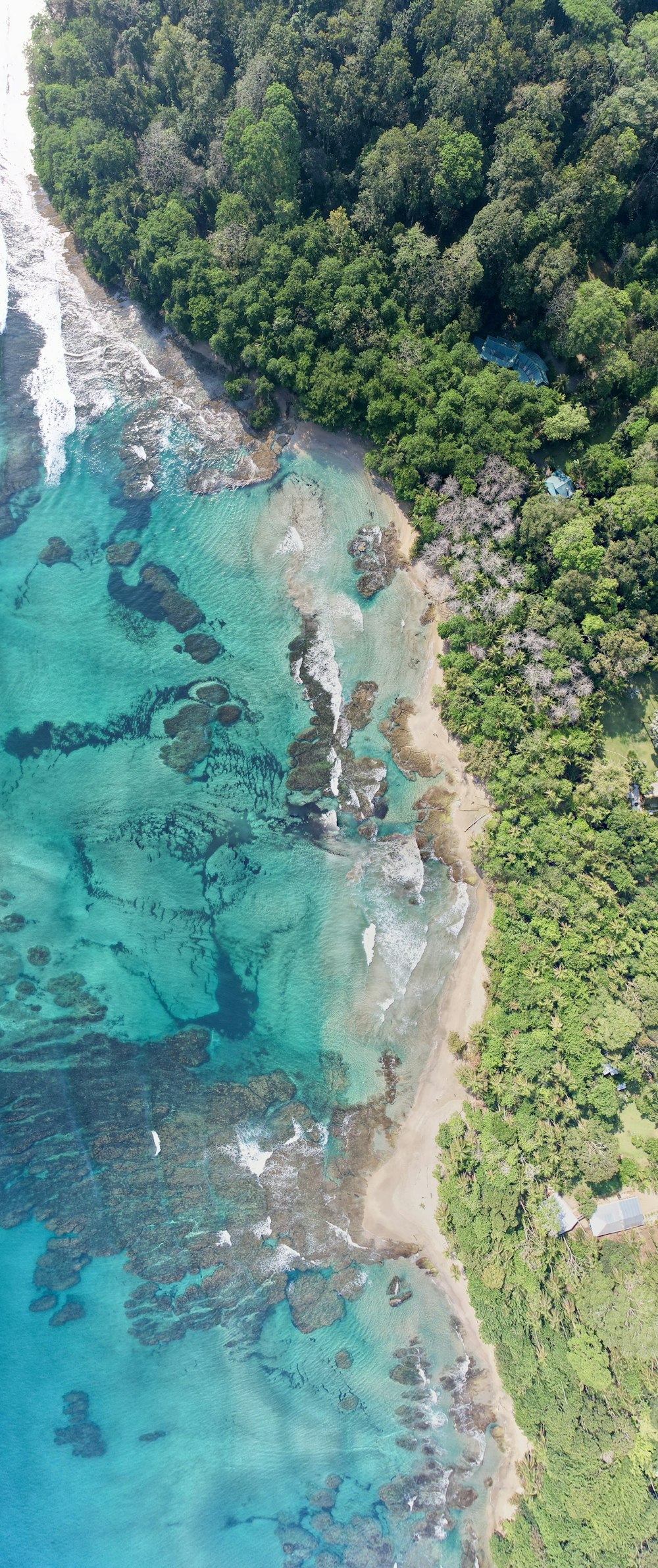 an aerial view of the ocean and land