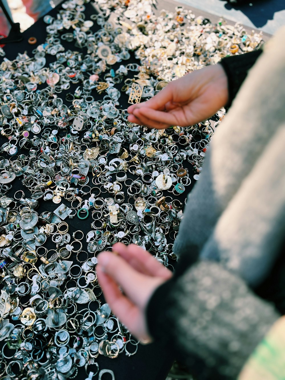 a person holding a bunch of rings in their hand