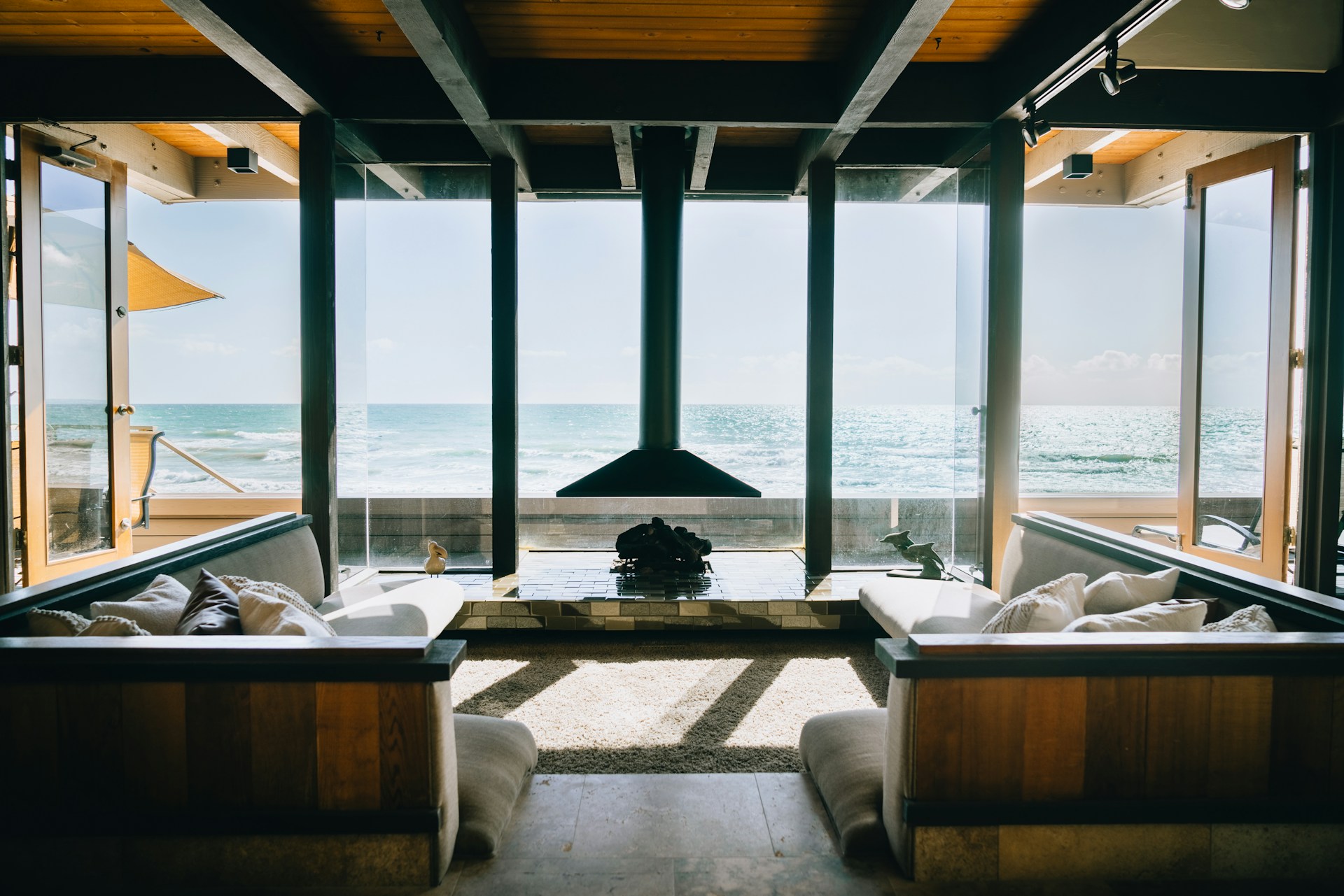 a living room filled with furniture next to a large window