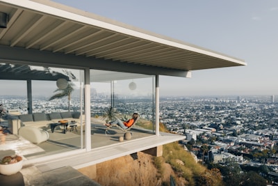 los angeles video production: a person sitting on a balcony overlooking a city