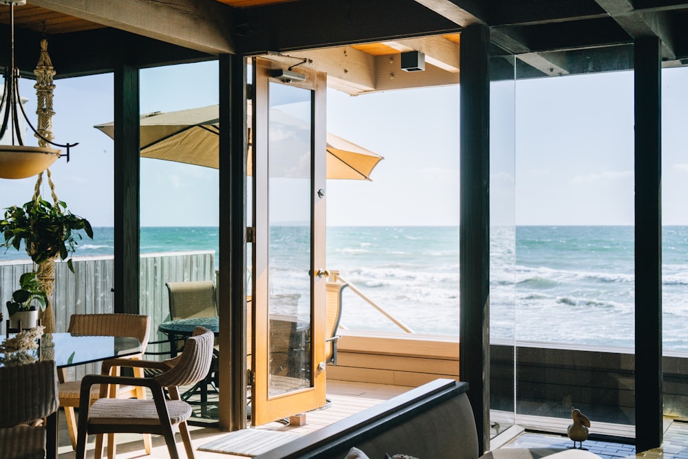 a living room with a view of the ocean