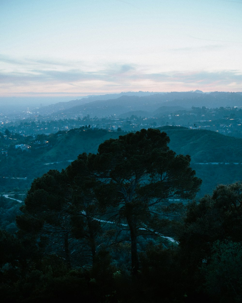 a view of a city from a hill