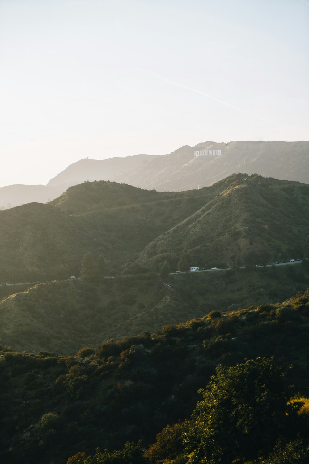 a scenic view of a mountain range with trees