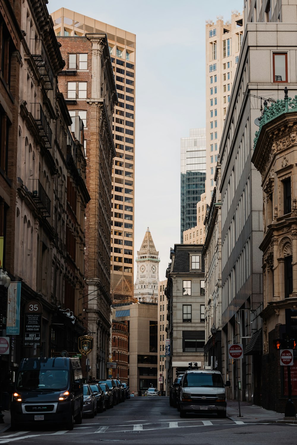 a city street filled with tall buildings and traffic