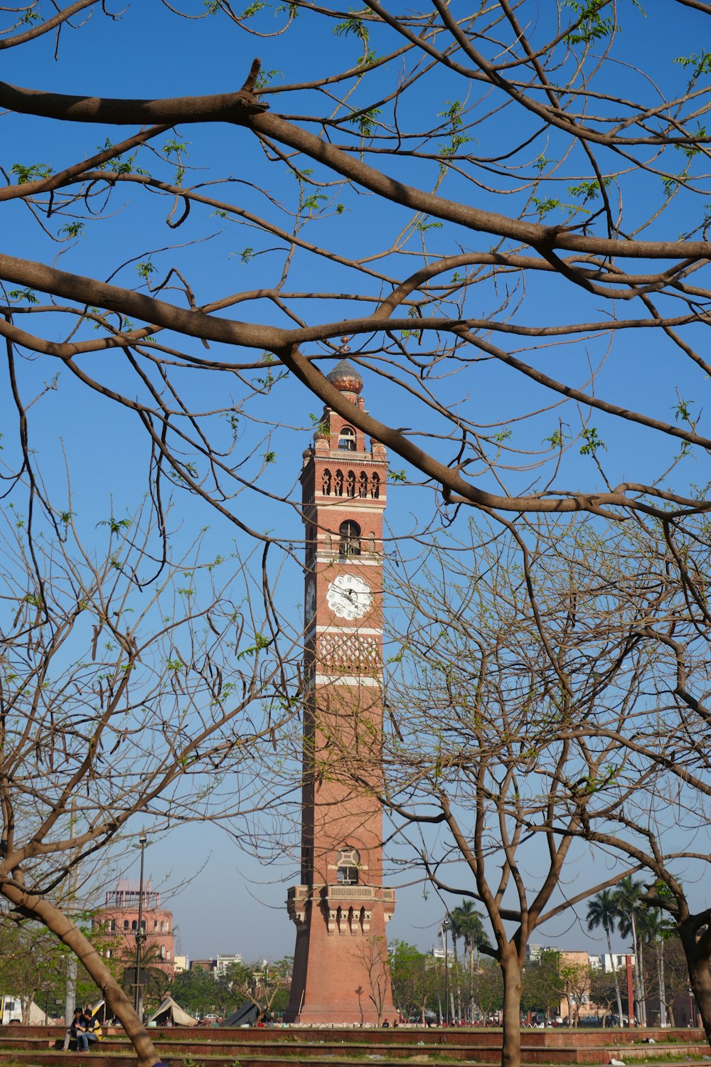 a tall tower with a clock on the top of it