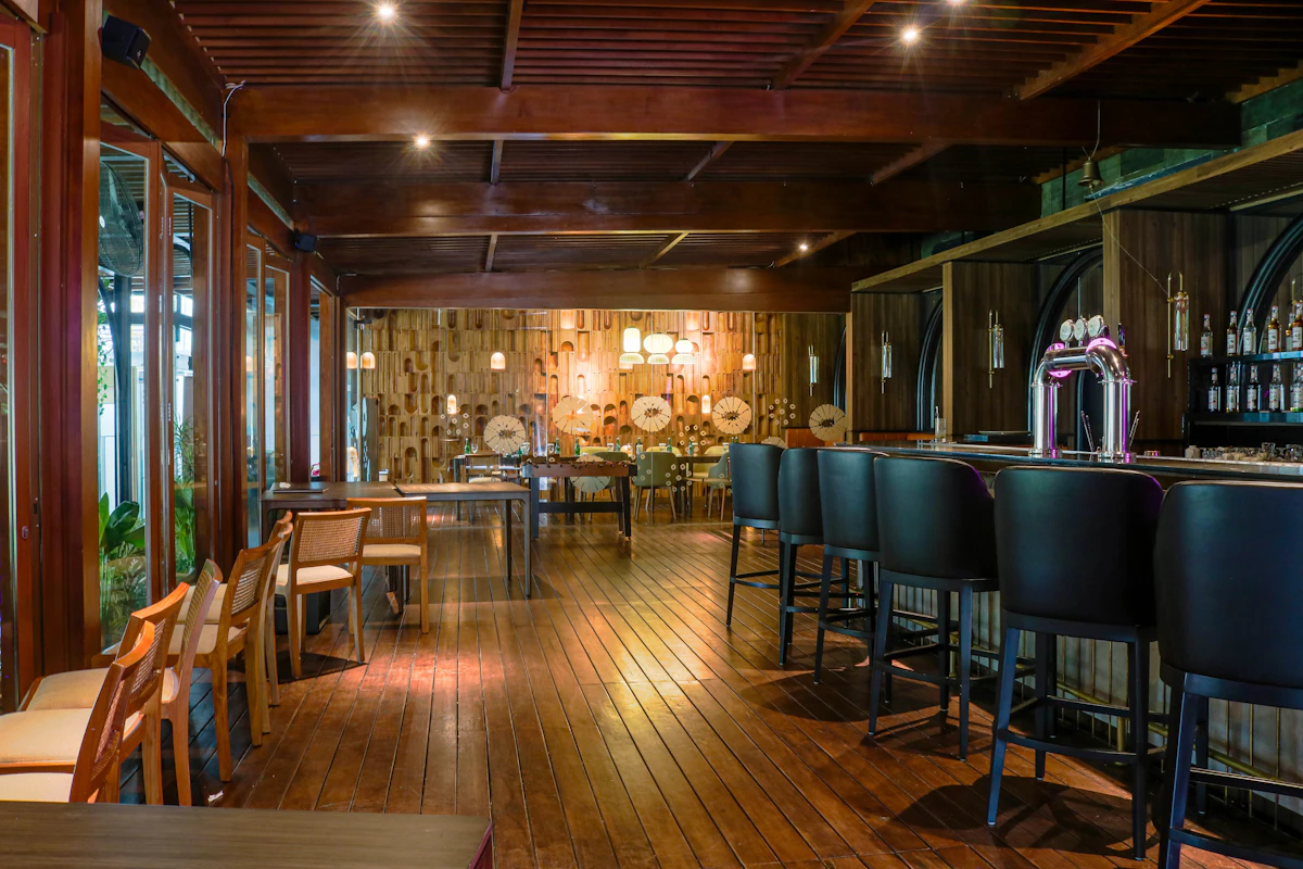 The dimly lit bar counter and wooden floor of Atlantic Lounge