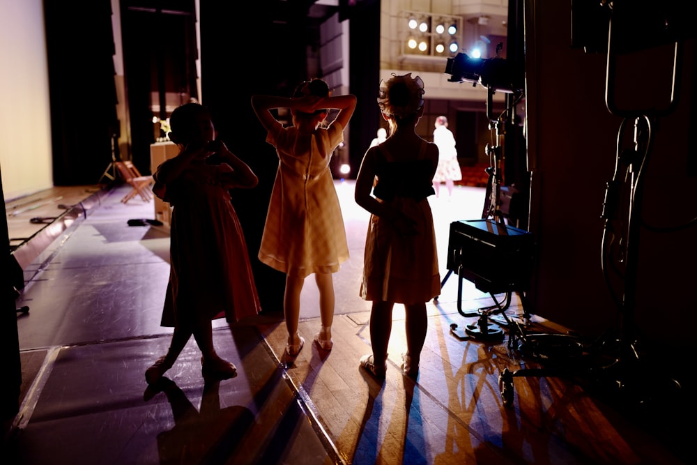 a group of young girls standing next to each other