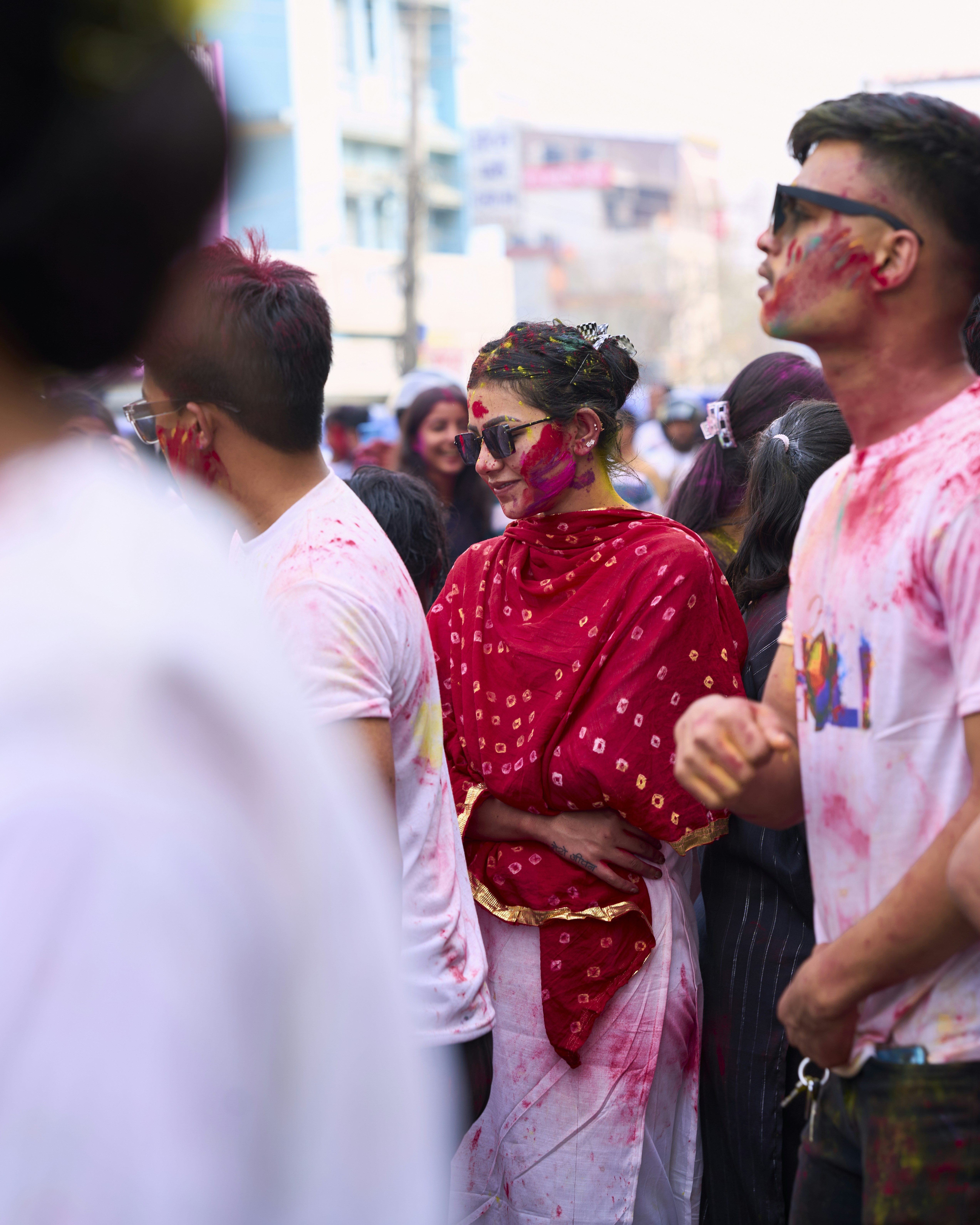 a group of people standing around each other