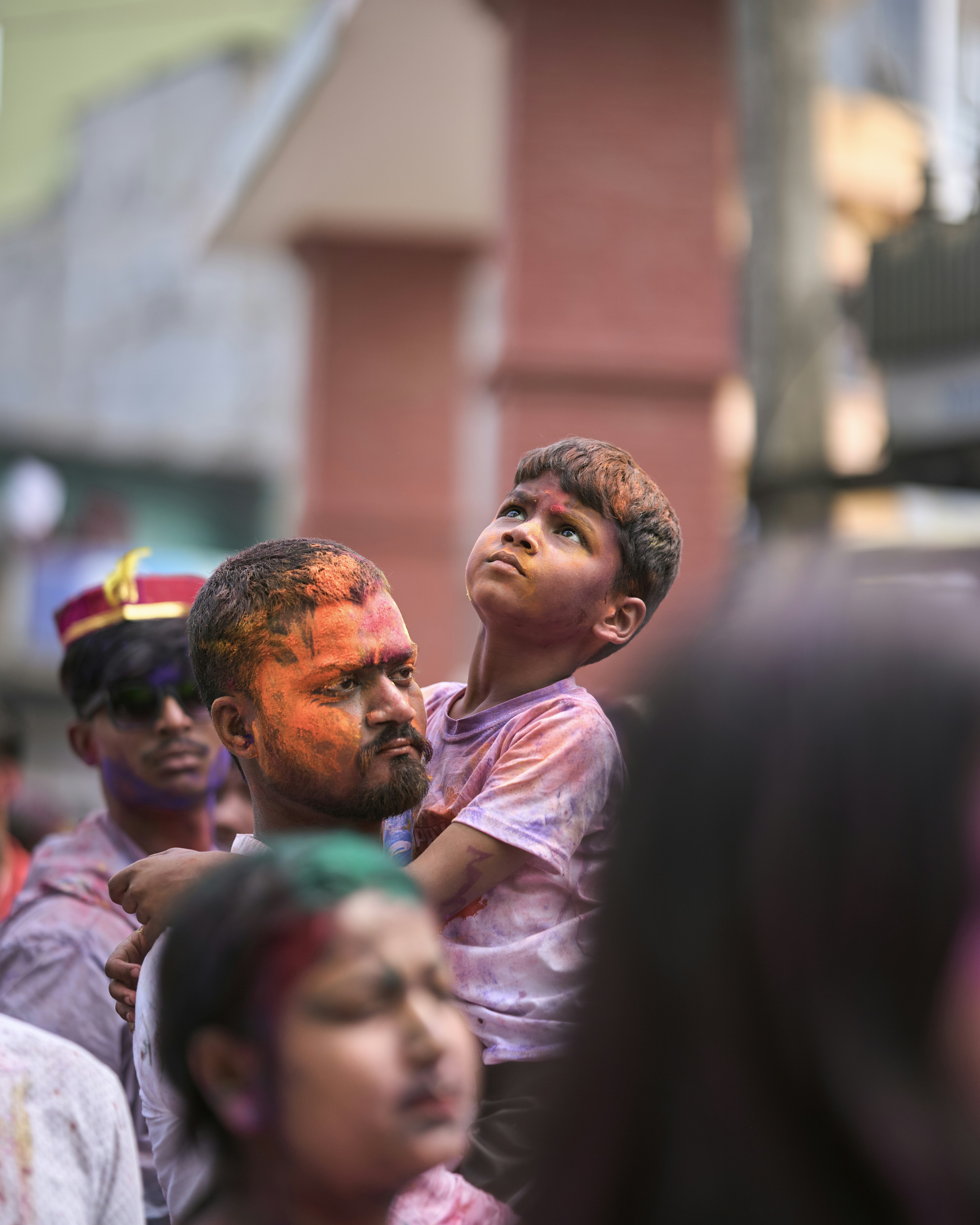 a group of people standing around each other