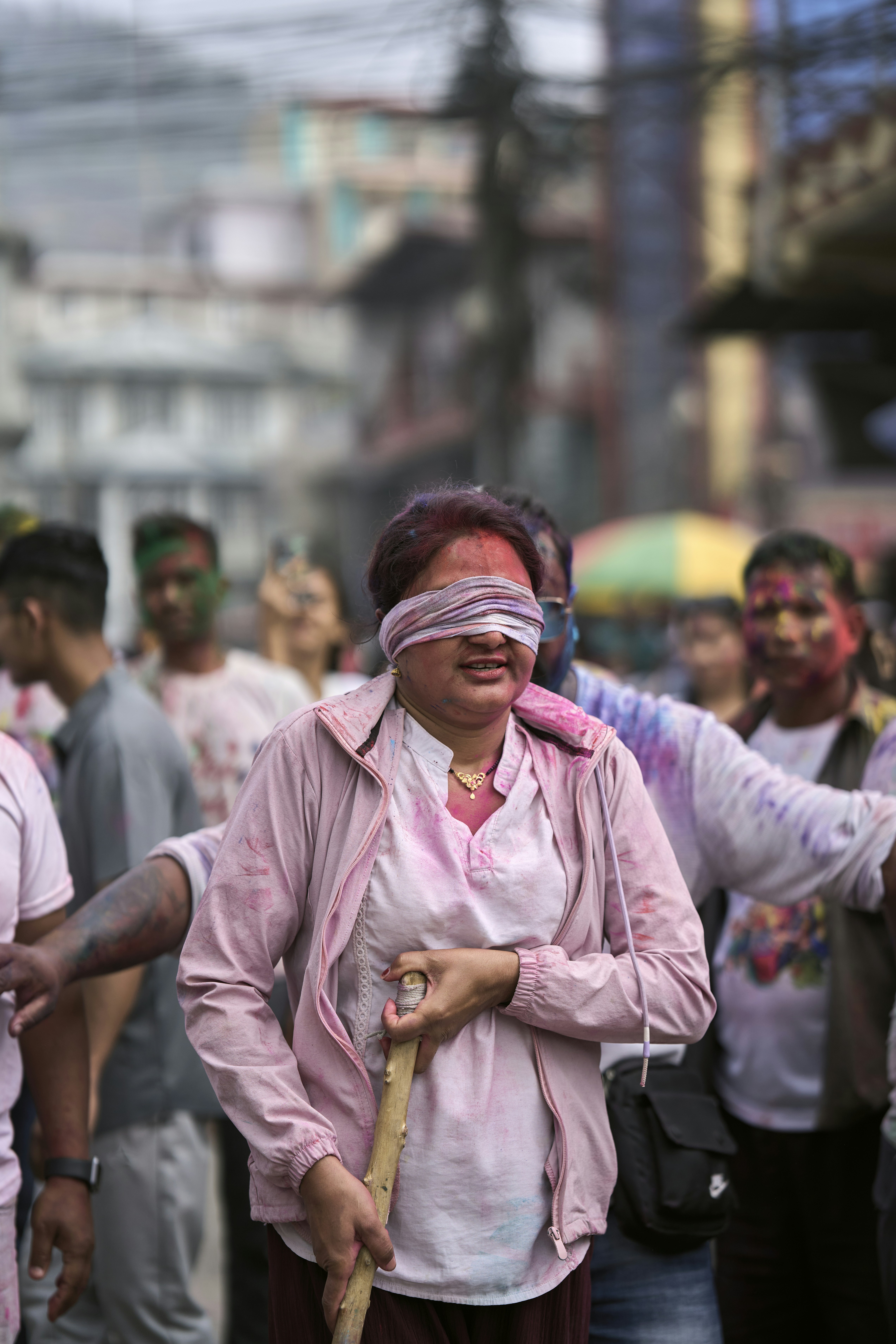 a group of people walking down a street