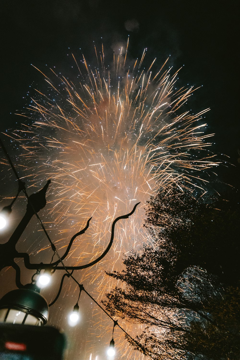 a firework is lit up in the night sky