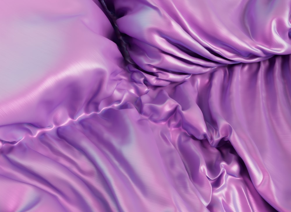 a close up of a purple satin material