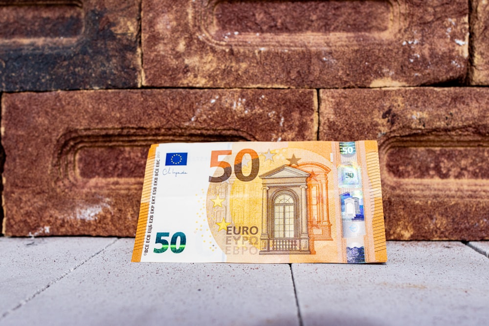 a 50 euro bill laying on the ground