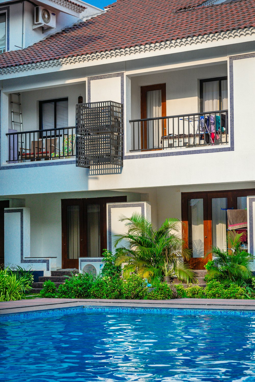 a house with a swimming pool in front of it