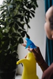 a woman is holding a blue and yellow banana