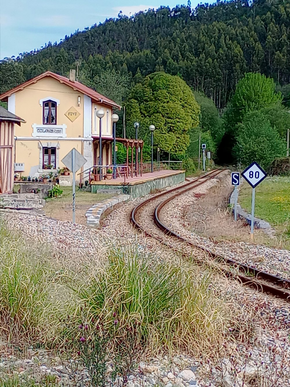 a train track running through a rural area