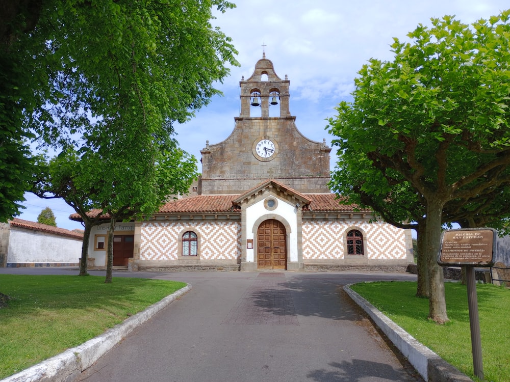 a church with a clock on the top of it