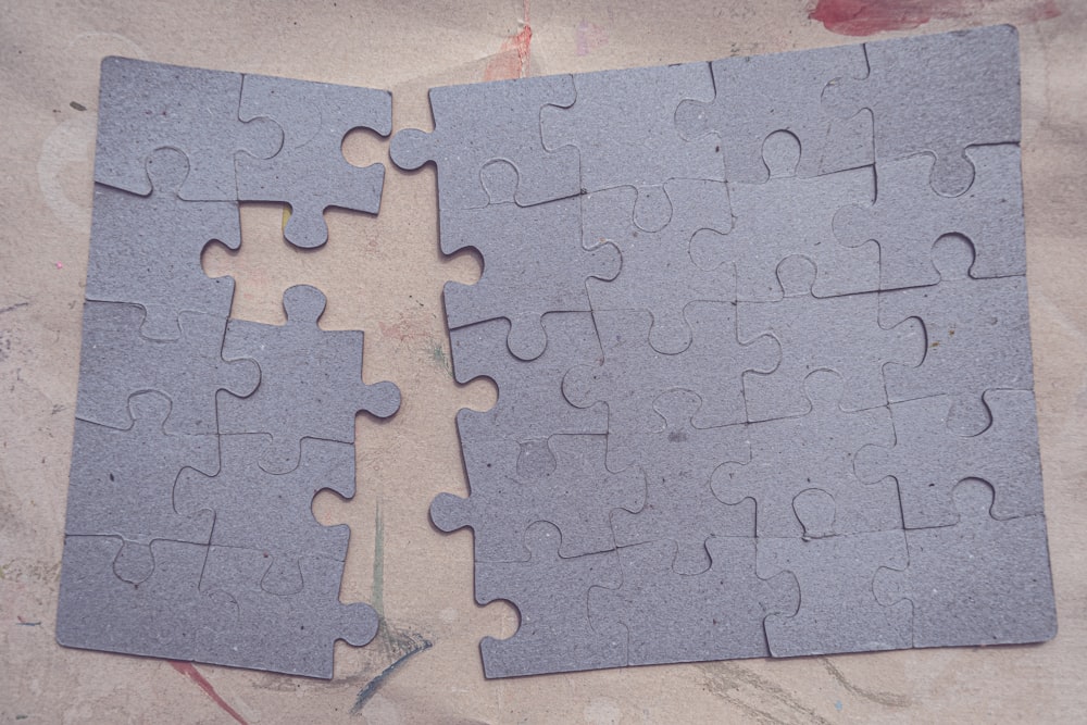 two pieces of a puzzle laying on top of each other