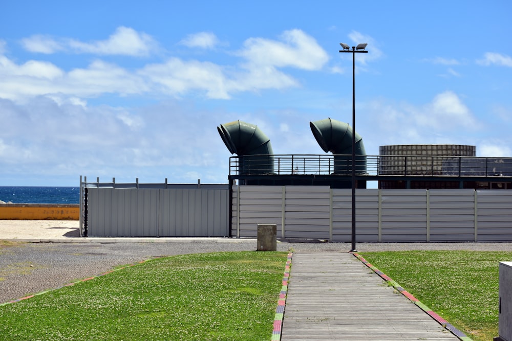 a walkway leading to the beach with a view of the ocean