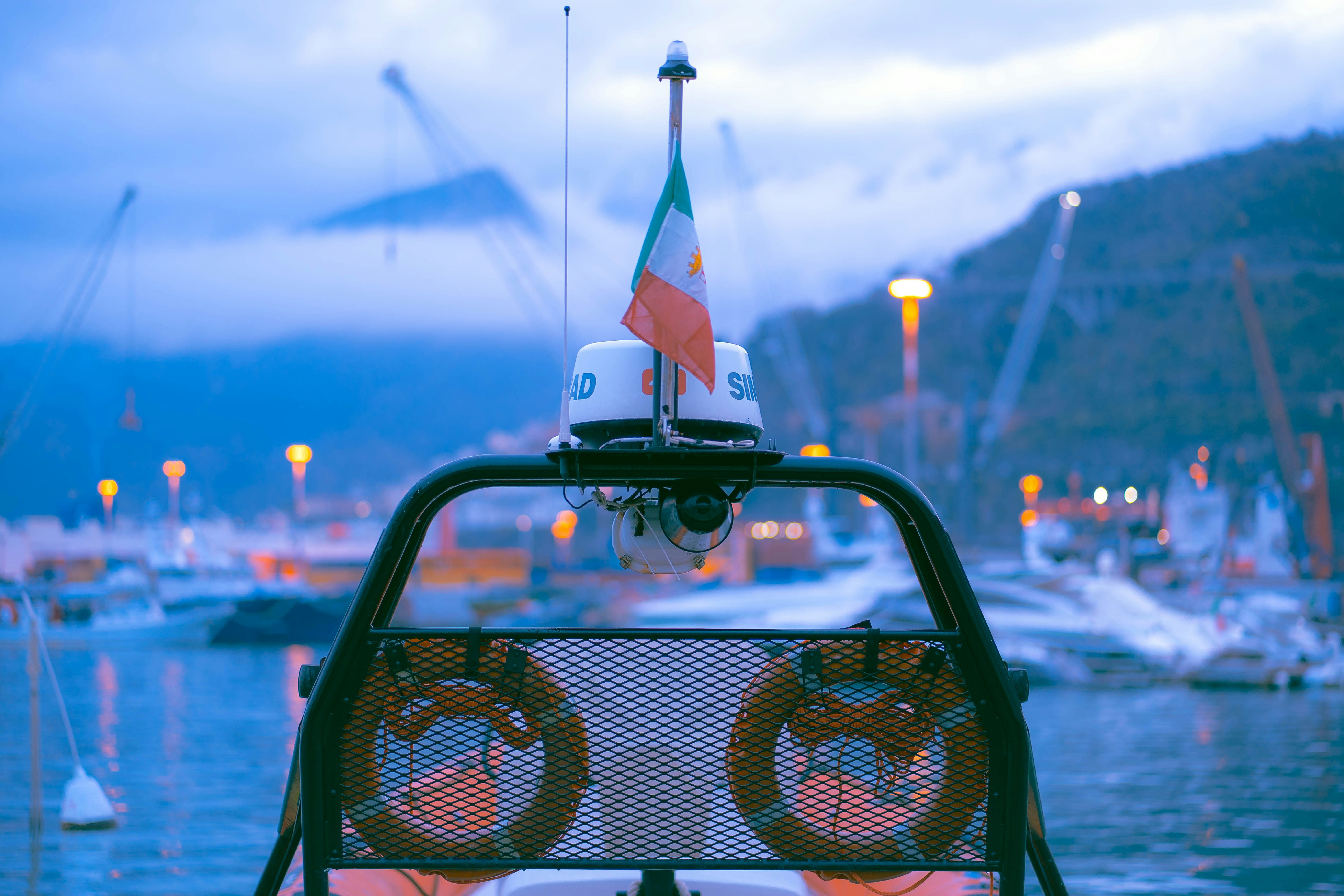 a view of a body of water with boats in the background