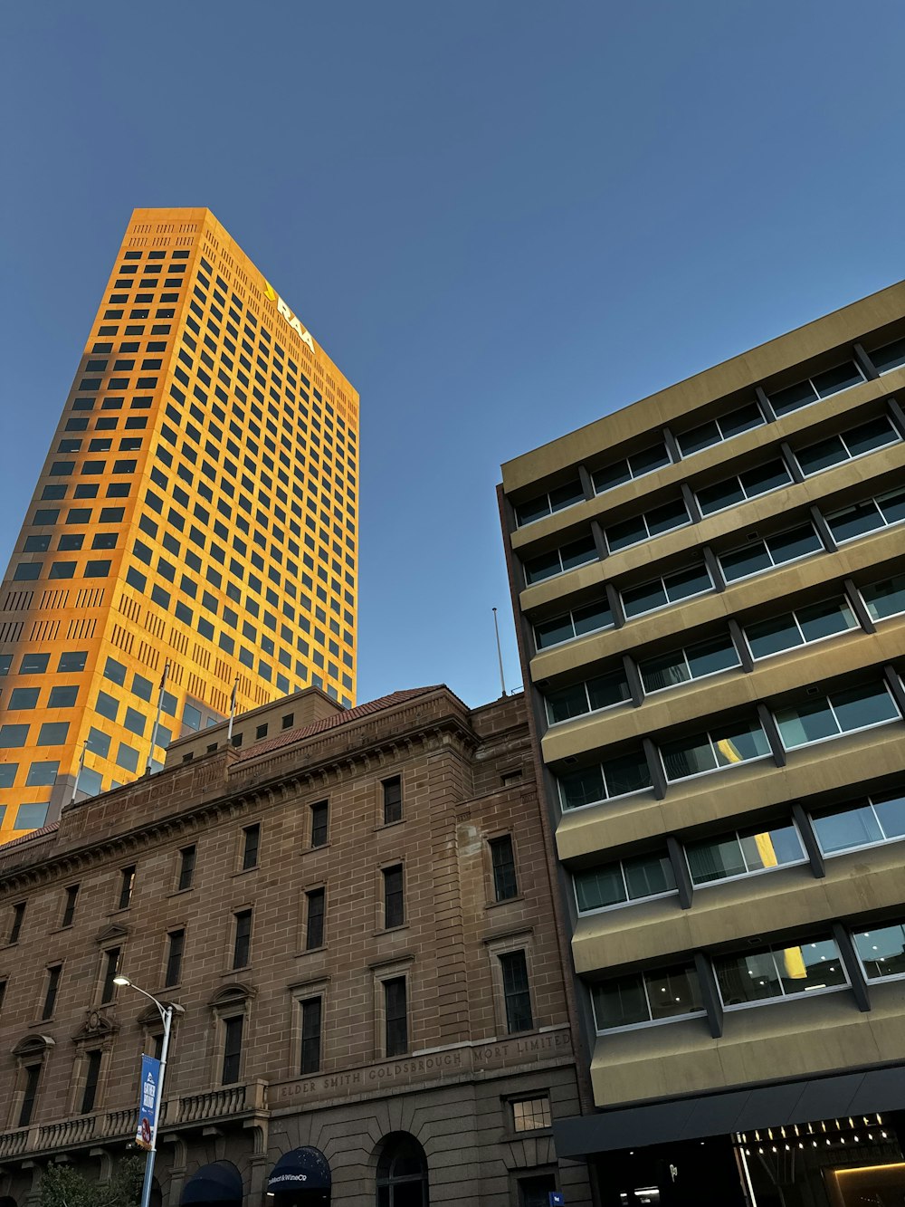 a very tall building sitting next to a tall building