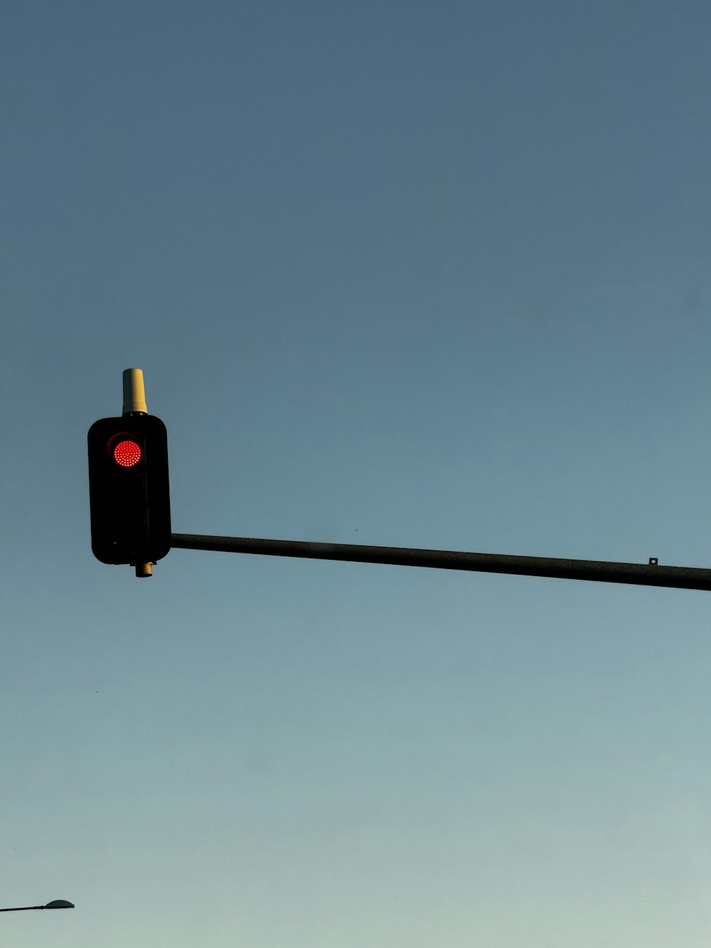 a traffic light hanging from a metal pole