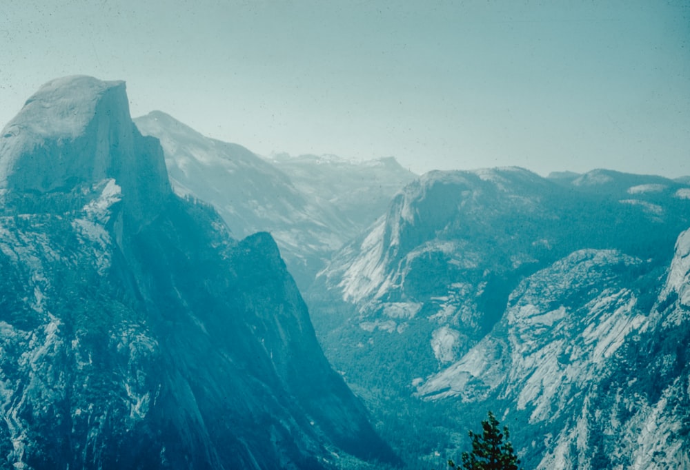 a view of a mountain range with snow on it