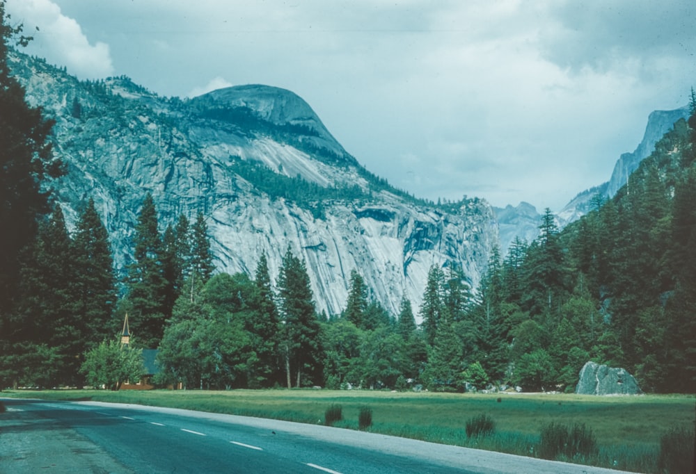 a road with a mountain in the background