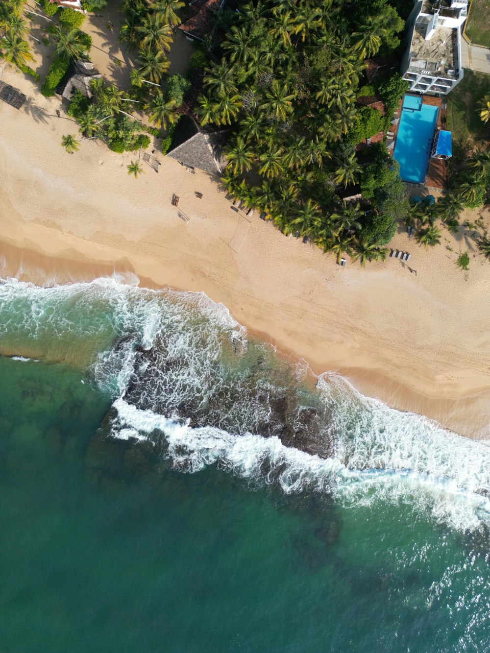 a bird's eye view of a beach and ocean