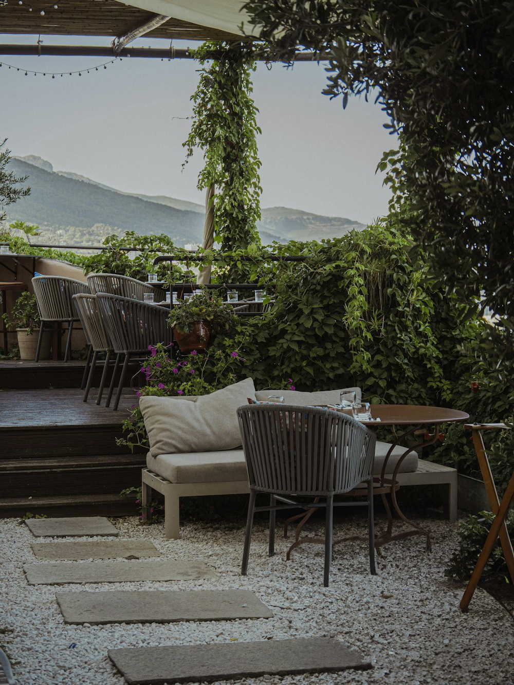 a patio with a couch, table and chairs