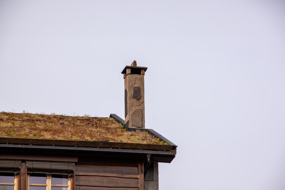 a building with a green roof and a clock tower