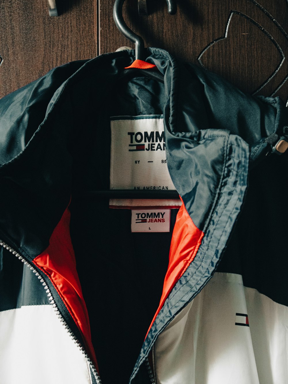 a tommy hilfiger jacket hanging on a coat rack