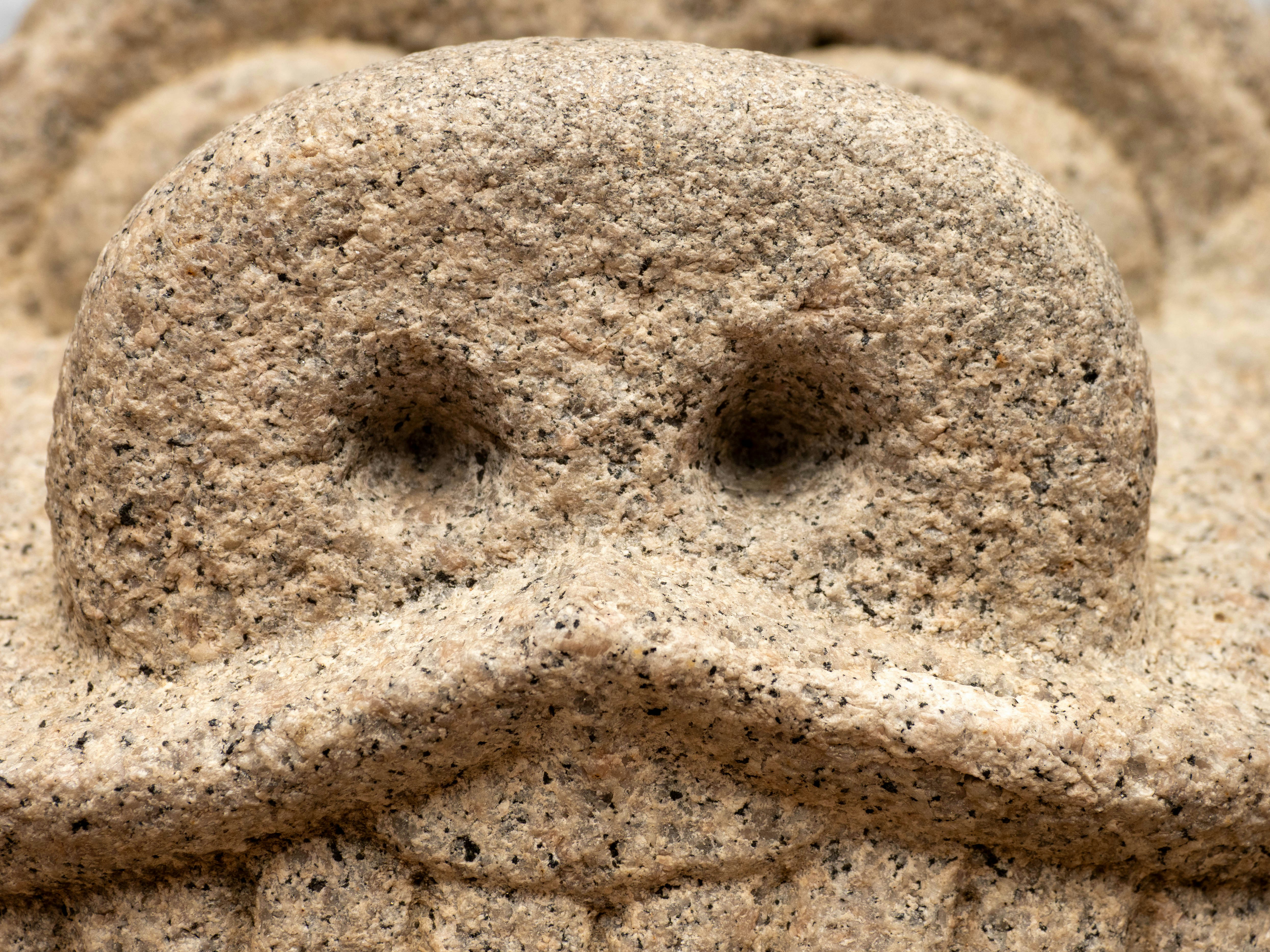 a close up of a statue of a man with a moustache