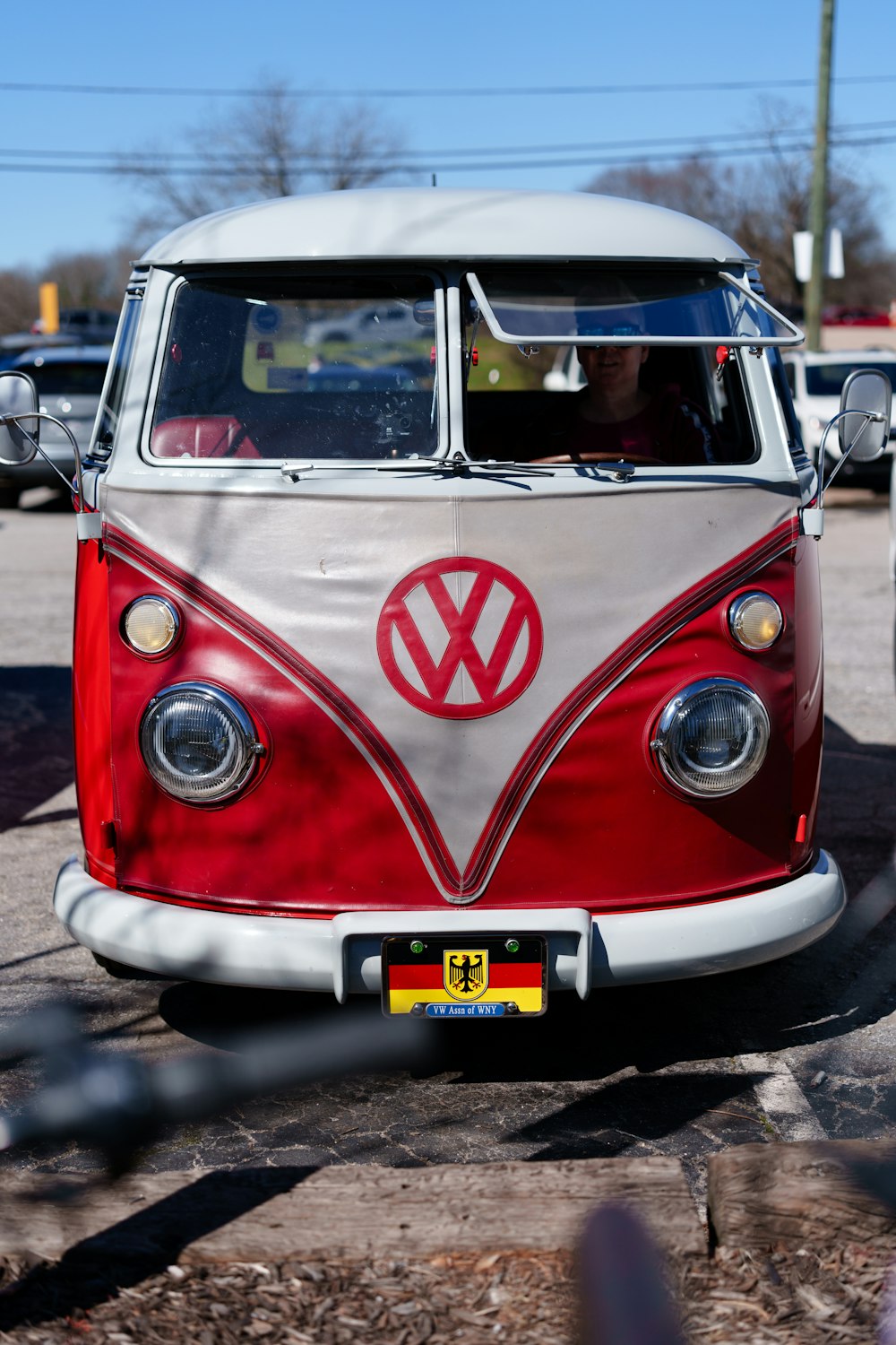a vw bus is parked in a parking lot
