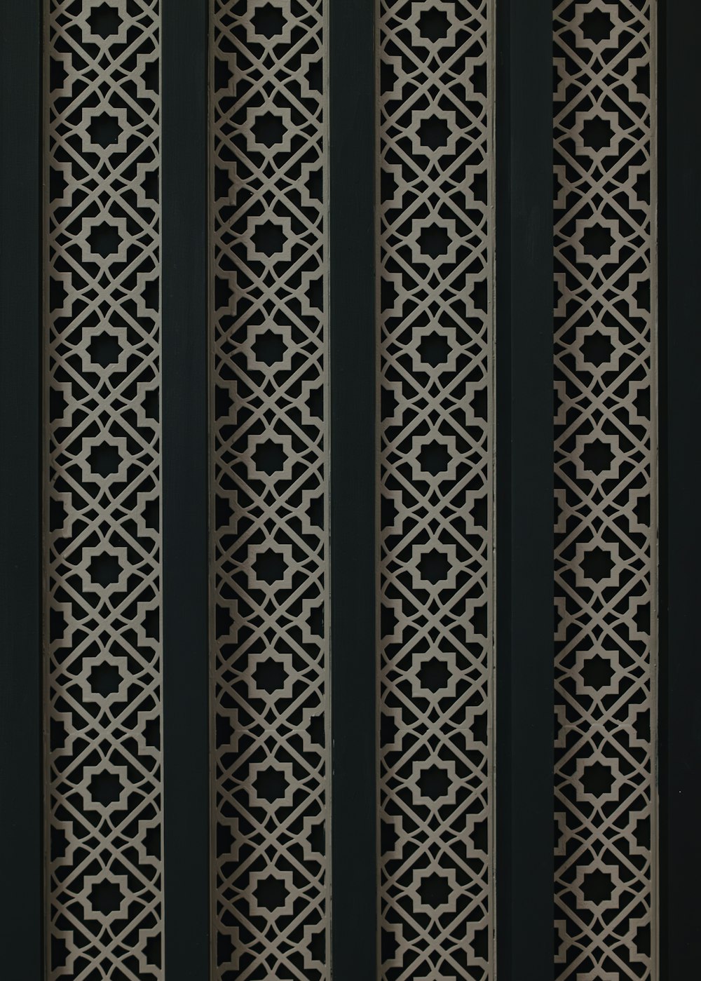 a close up of a metal screen with a design on it