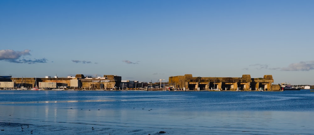 a body of water with buildings in the background