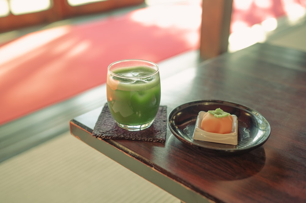 a plate of food and a drink on a table