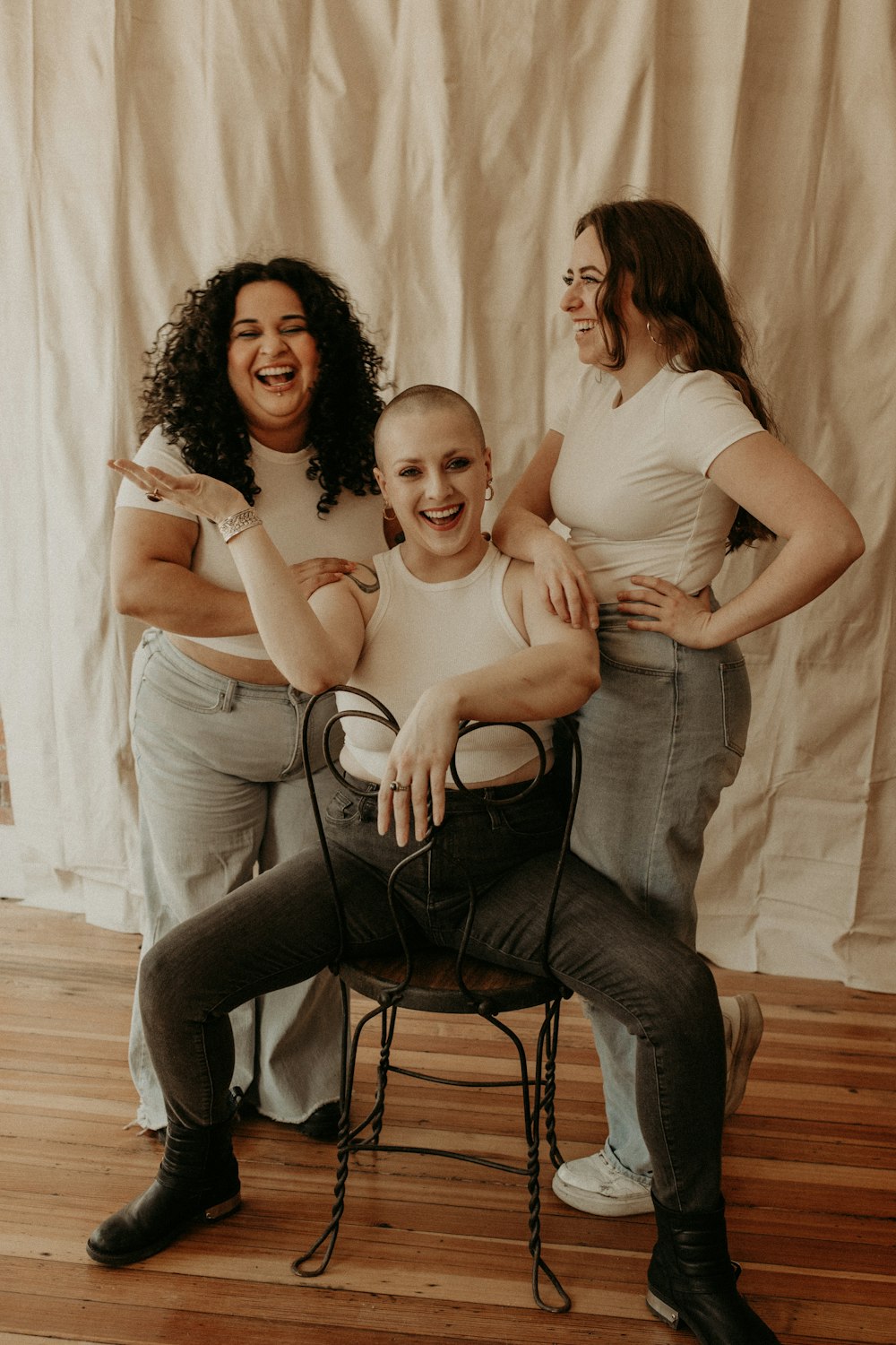 three women and a boy posing for a picture