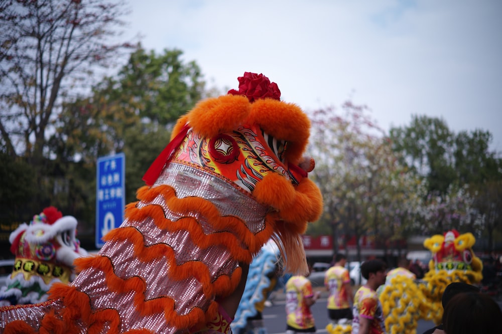 a man in a dragon costume walking down a street