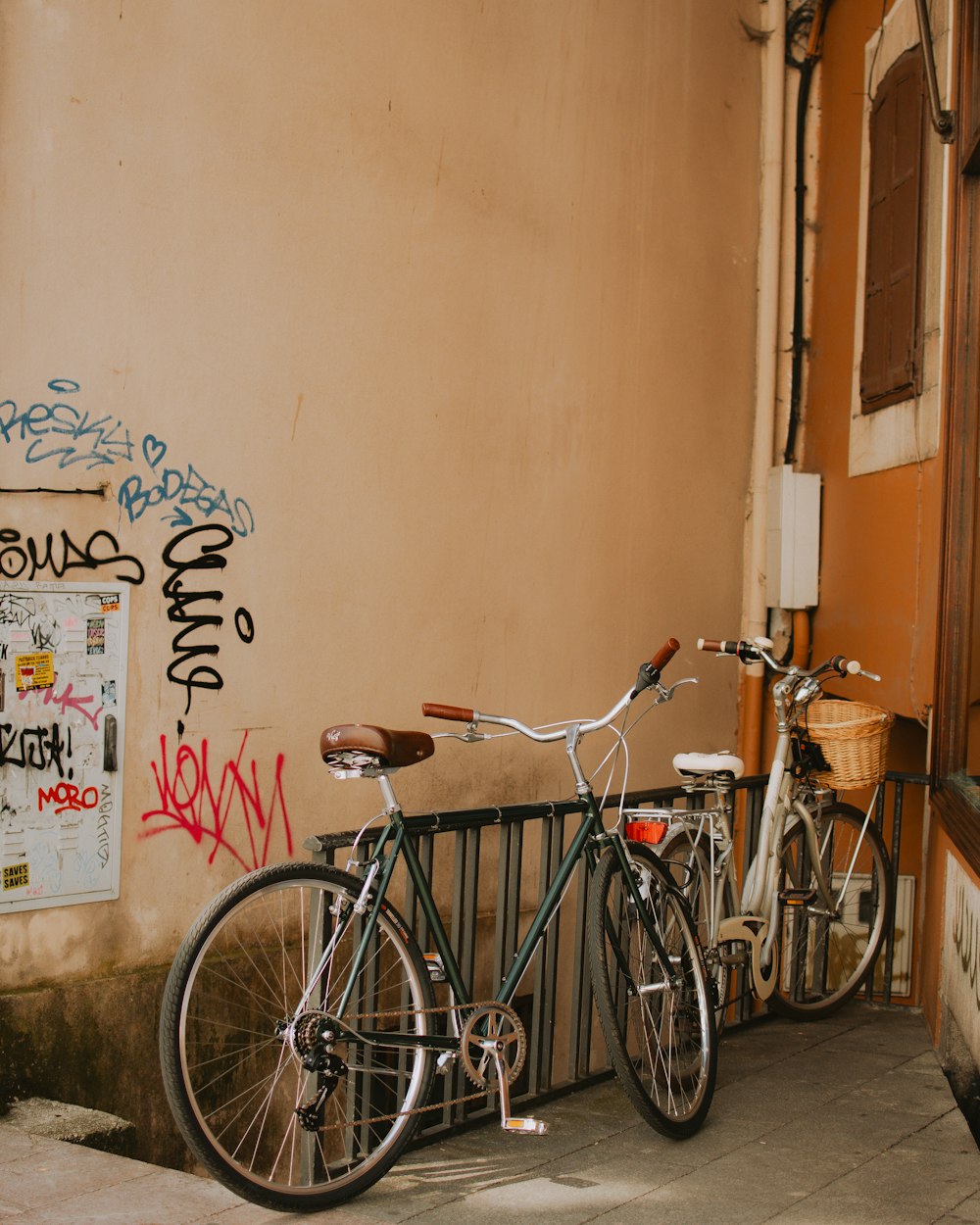 a couple of bikes parked next to a building