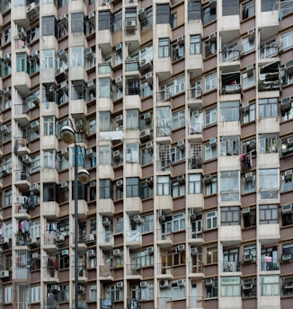 a tall building with lots of windows and balconies