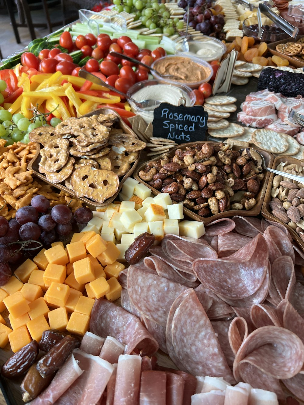 a variety of meats and cheeses on a table