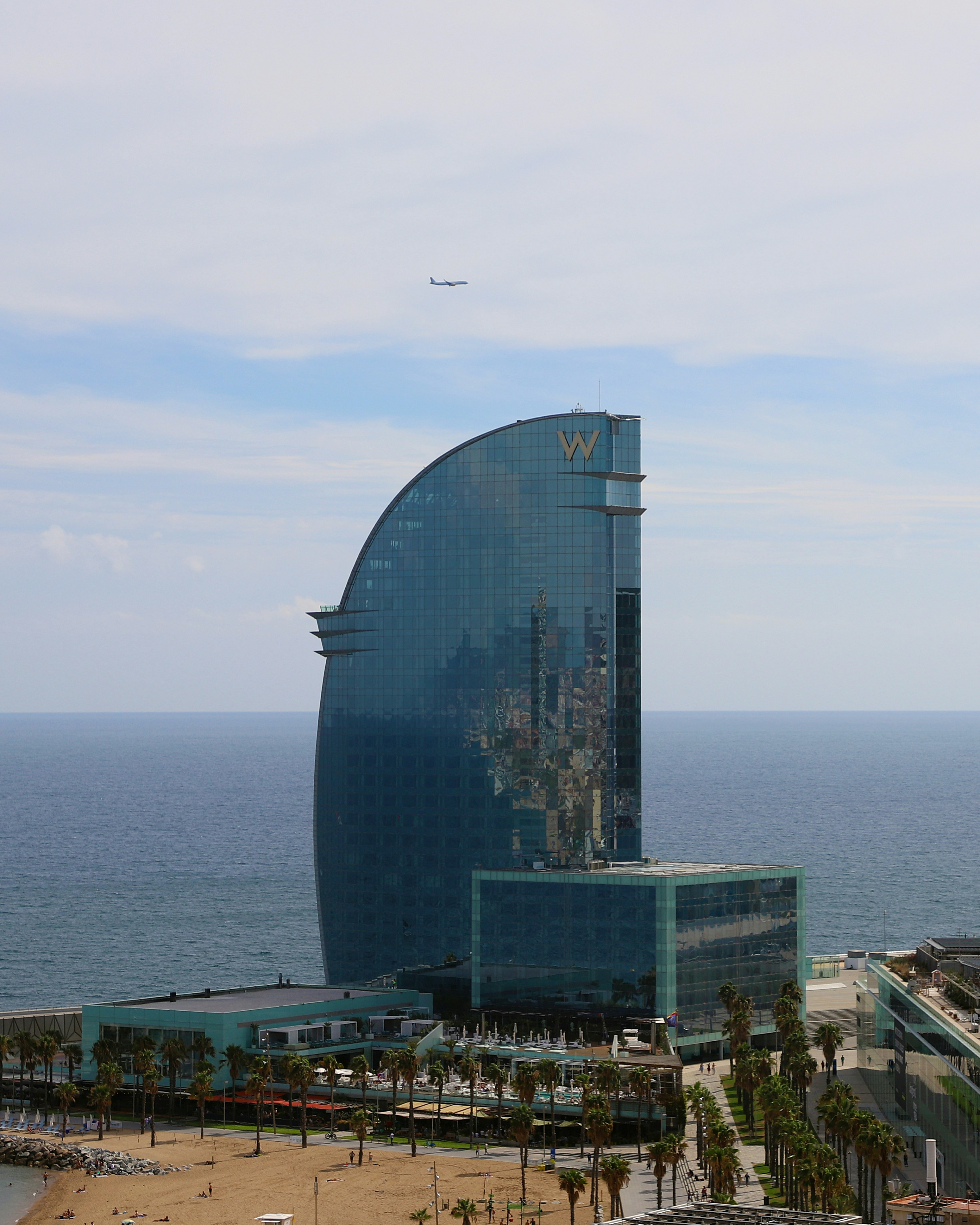 a very tall building sitting next to the ocean