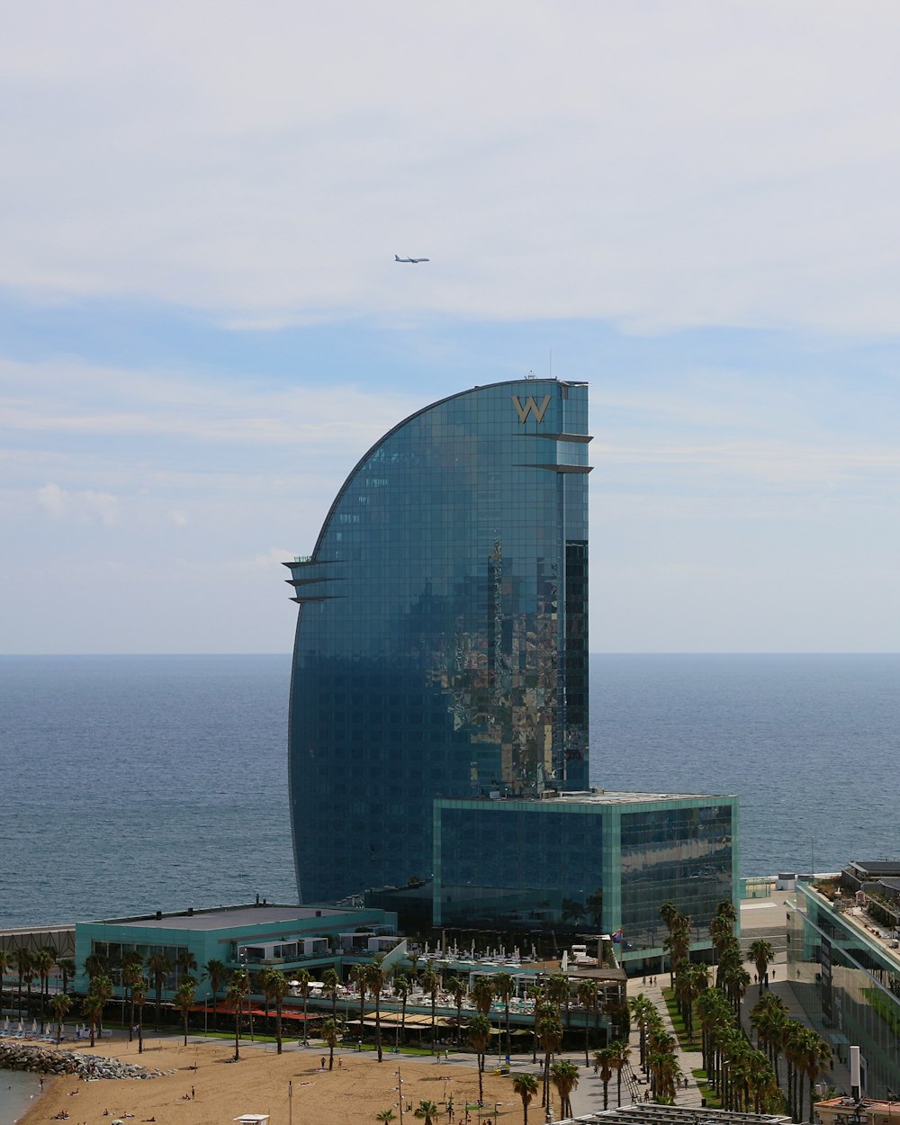 a very tall building sitting next to the ocean