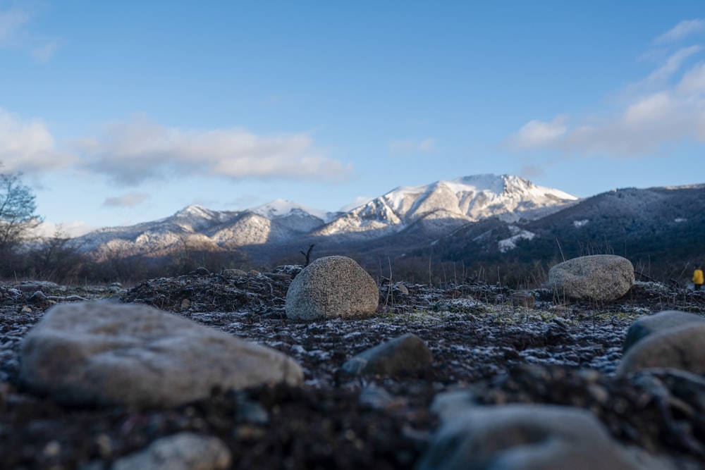 a mountain range with snow covered mountains in the background