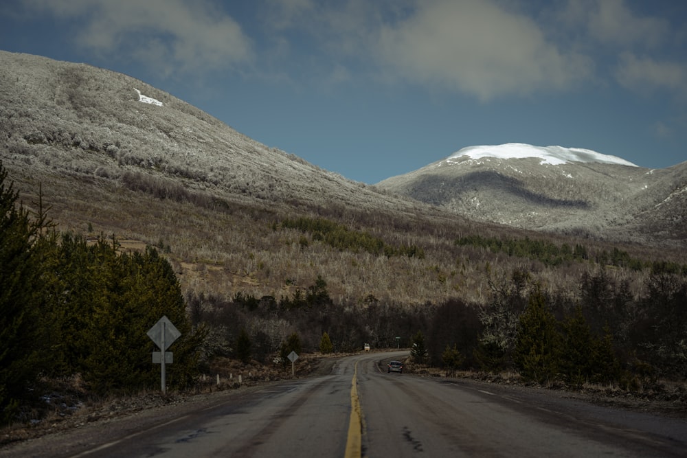 a road with a mountain in the background