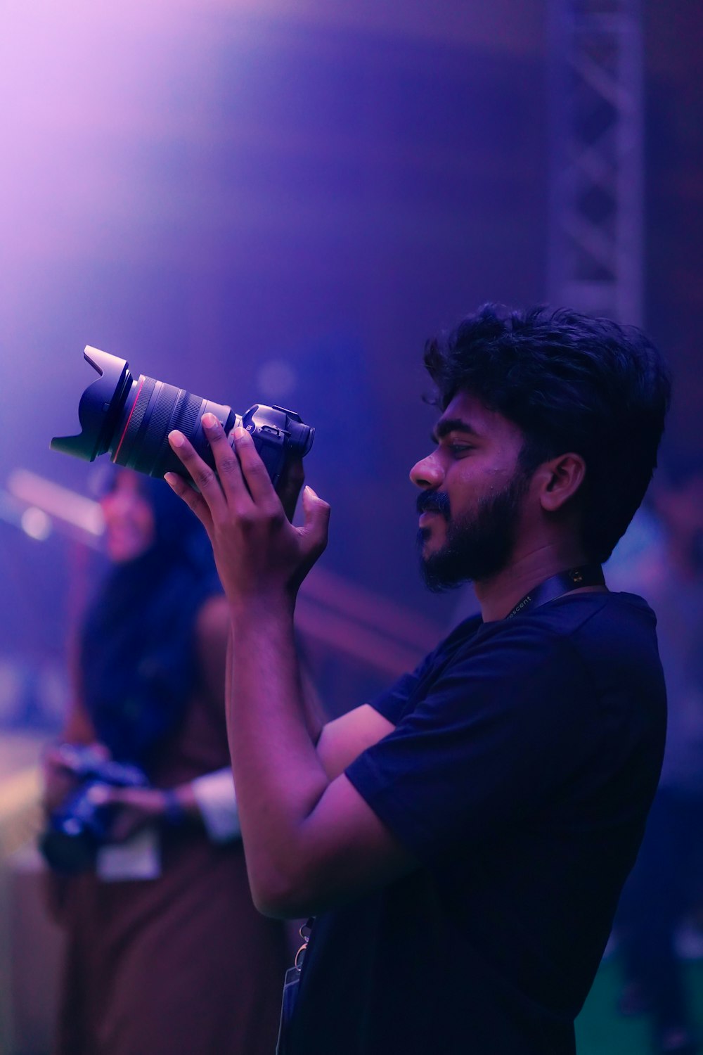 a man holding a camera up to take a picture